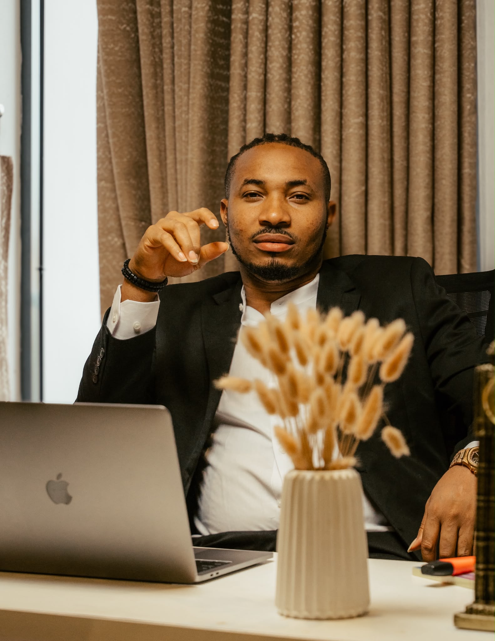 Sir KennyBless at desk
